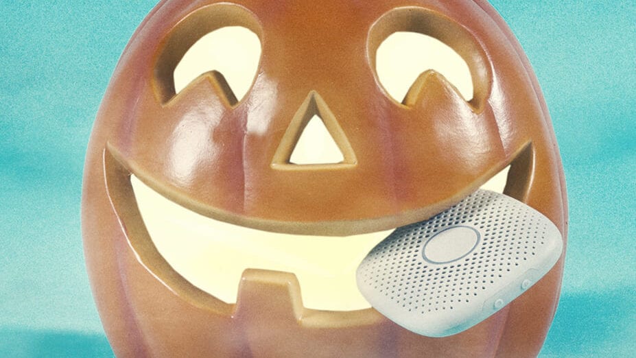smiling jack-o-lantern with a Relay kids phone
