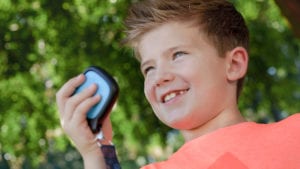 happy kid with wearable relay loop case