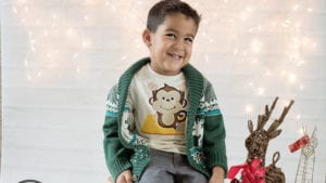 child in holiday sweater